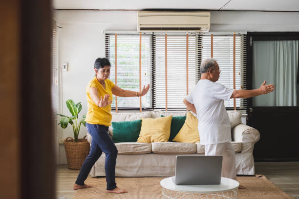 istock Asian old senior workout exercise and doing yoga at home 1248192344