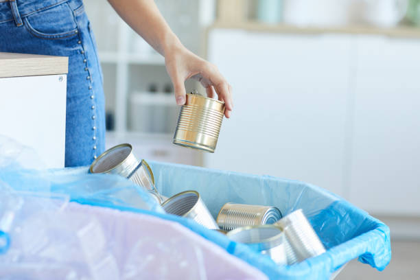 istock Woman throwing out the cans 1248193919