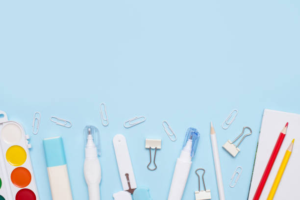 istock school Flat lay of stationery on blue background, copy space 1248193971