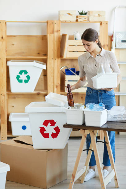 istock Woman recycling glass 1248194101