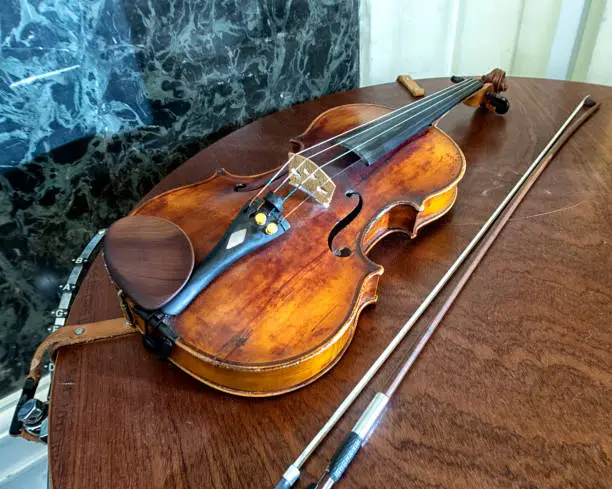 Photo of violin on stage before a symphonic classical concert