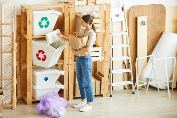 istock Woman sorting waste in bins 1248194415