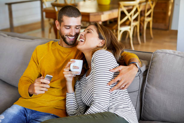 istock Couple enjoying on sofa at home in quarantine 1248195263
