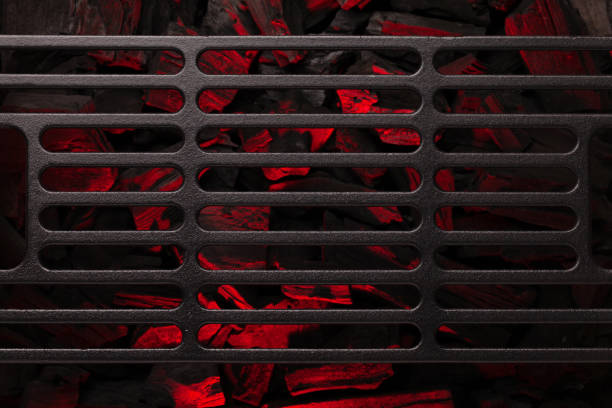 Metal barbecue grill over hot coal Metal barbecue grill over hot coal. Top view flat lay. Backdrop for your cooking food metal grate photos stock pictures, royalty-free photos & images