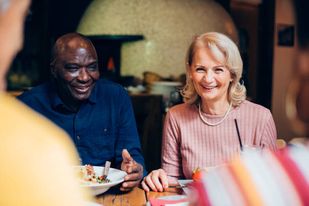 istock Group of seniors enjoying dinner at the restaurant 1248196011
