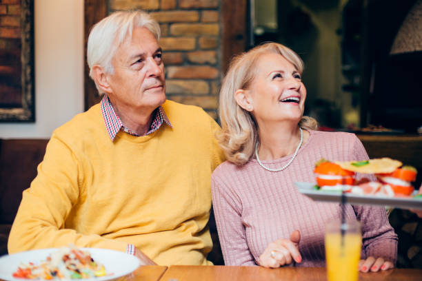 istock Senior couple getting their meal at the restaurant 1248196024