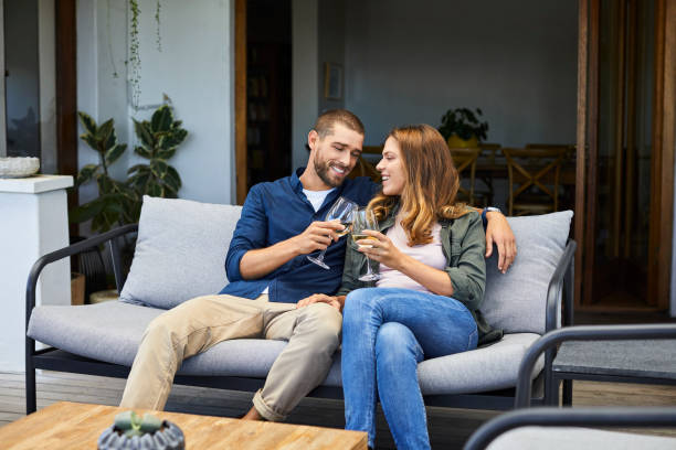 istock Smiling couple toasting wineglasses at home 1248196038