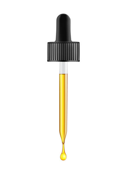 istock Glass pipette with gold drop of oil 1248197033