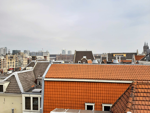 roofs of houses and buildings in the city center of amsterdam in holland