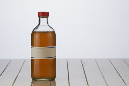 Small pharmacy bottle against a white background.