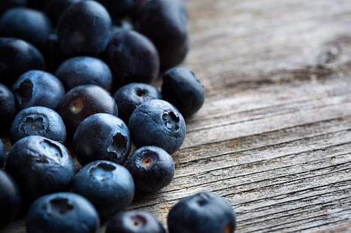 Blueberries from organic farming on wooden background