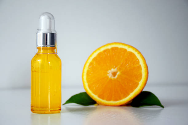 istock Vitamin C serum and half of orange 1248197528