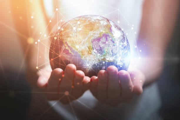 istock Woman holding in hands with global connection concept. technology concept, Elements of this image furnished by NASA 1248200756