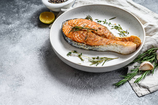 istock Grilled salmon steak. Atlantic fish. Gray background. Top view. Space for text 1248200883