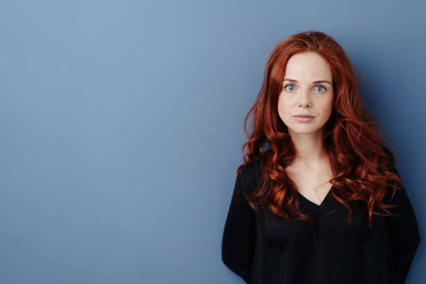 istock Intense young woman staring wide eyed at camera 1248202131