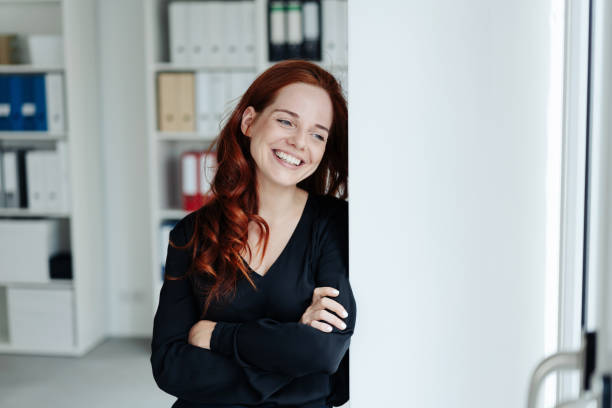 istock Pretty young woman standing watching outside 1248202244