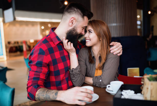 istock Young beautiful couple in coffee bar 1248202408