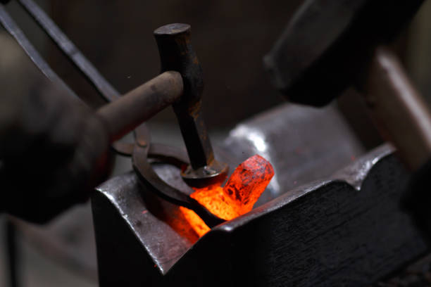 istock Forging the molten metal, making of an axe 1248202660