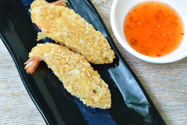 istock crispy fried shrimp coating flake bread and flour dipping with sweet chili sauce 1248207796