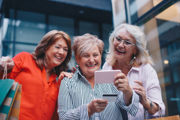 istock Three friends senior women out shopping 1248209040