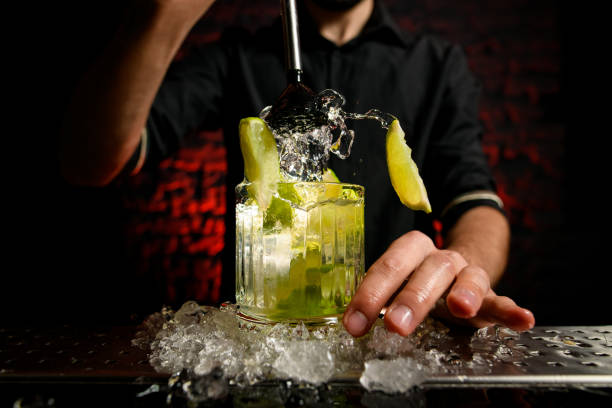 istock close-up barman expressively mix cocktail using metal madler 1248209634