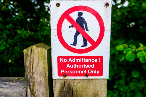 istock Strictly no admittance to unauthorised persons on wooden gate post 1248209658