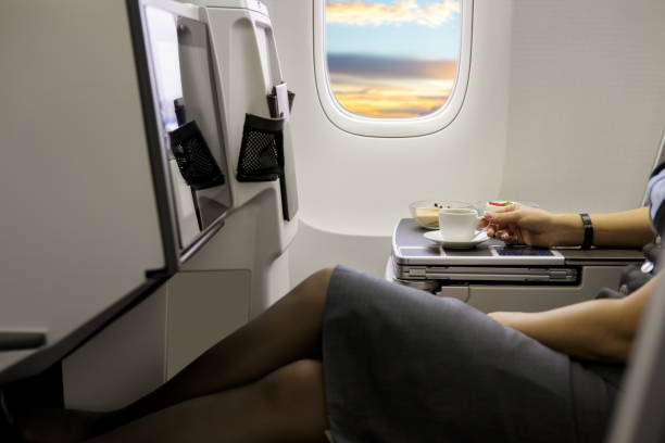 istock Cup of fresh espresso on table in airplane interior 1248212067