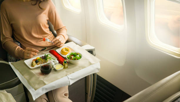 Tasty meal served on board of airplane on the table Tasty meal served on board of airplane on the table airplane food stock pictures, royalty-free photos & images