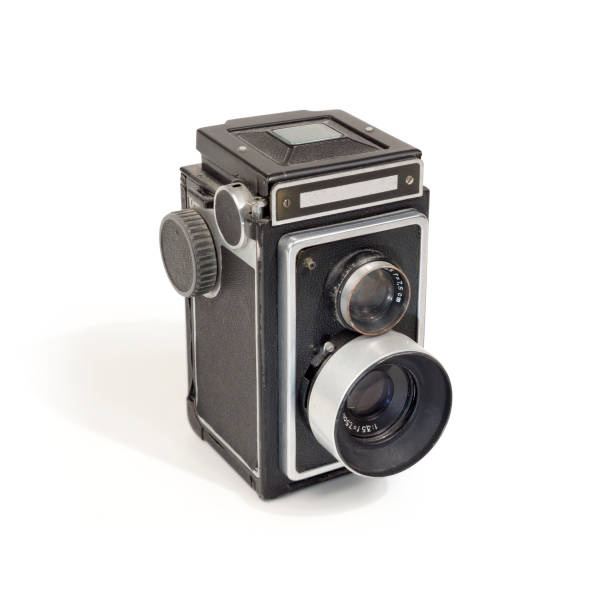 istock Vintage black closed binocular mirror reflex camera on white 1248216361
