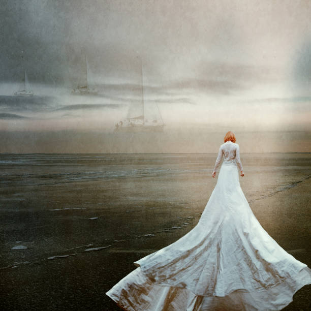 Woman alone with surreal sea, longing and waiting. Woman alone with surreal sea, longing and waiting. Grain and grunge. walking beach women sadness stock pictures, royalty-free photos & images
