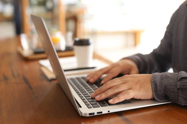 istock Concept work from home.man working on laptop and coffee cup. 1248223224