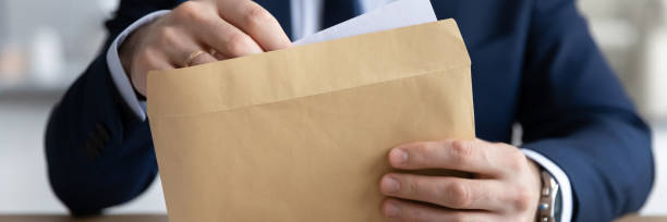 istock Panoramic view of businessman open postal correspondence 1248226424