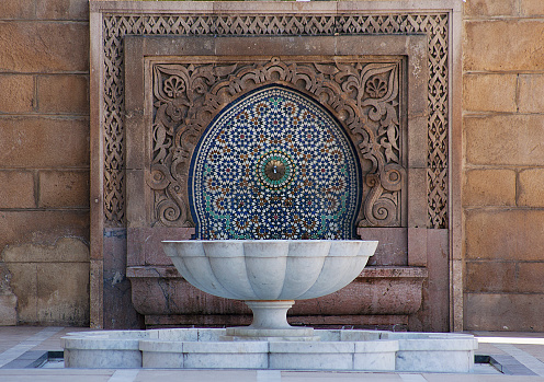 Colour photograph of decorated fountain with mosaic tiles in Rabat