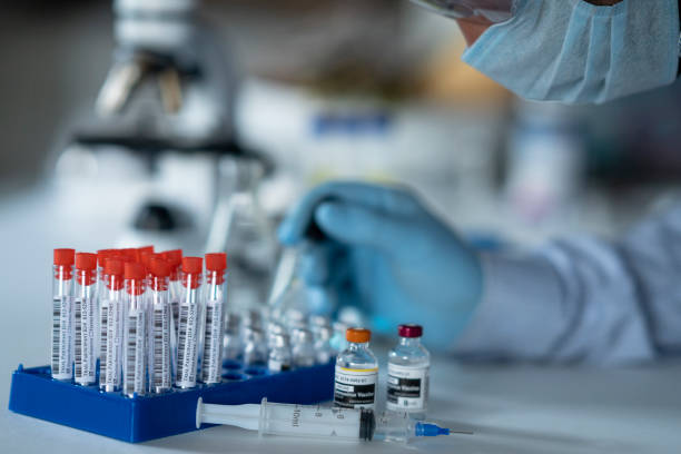 istock Medical researcher using an eye dropper in a laboratory while studying a COVID-19 vaccine 1248228015