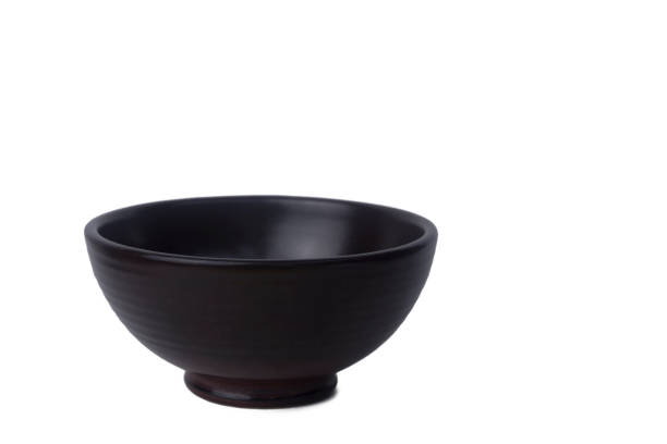 istock Close up Brown ceramic bowl isolated on white background. 1248229167