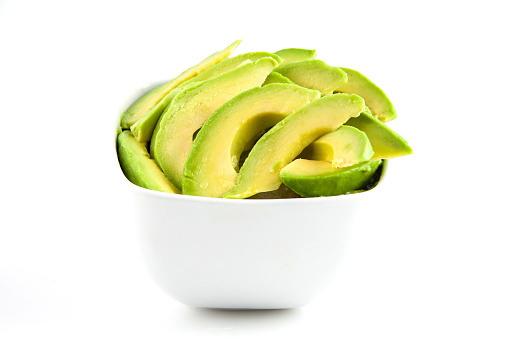 Avocado in portions on white background