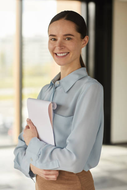 istock Smiling Female Manager Looking at Camera 1248235384