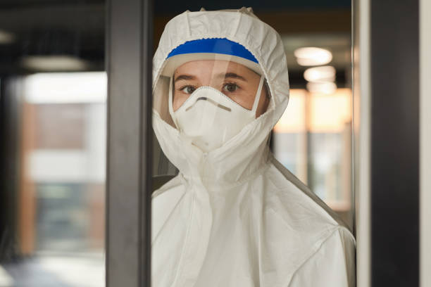 istock Female Worker Wearing Respirator 1248235498
