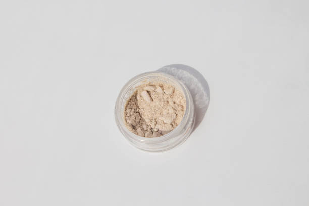istock Blusher, eyeshadow and transparent face powder on white background with copy space, close-up. 1248237374