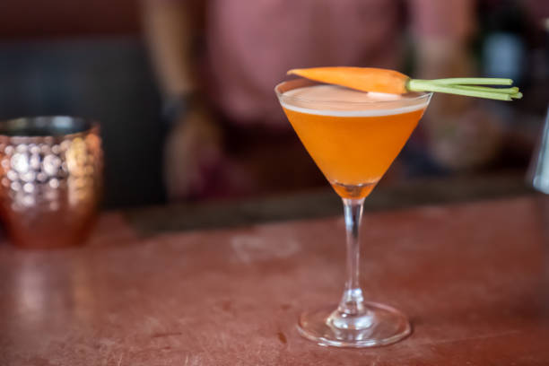 istock carrot mocktail are mixed and ready to serve on red bar. 1248240898