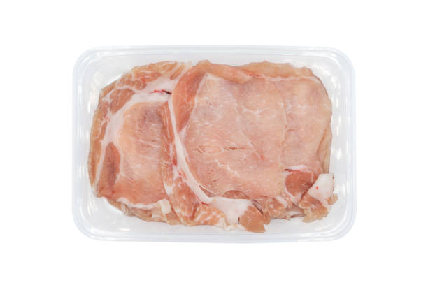 istock fresh Sliced raw pork in plastic box on white clear background. Clipping Paths. 1248242214