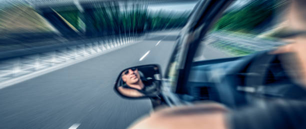 driver drives a car. motion blur. - swerving imagens e fotografias de stock