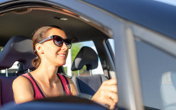 istock Woman driver driving a car. 1248242278