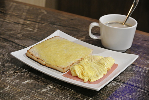 Scrambled eggs , ham , toast and coffee , Hong Kong