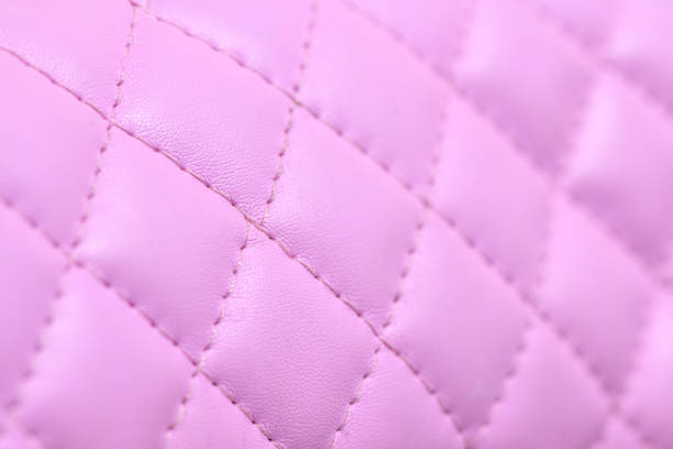 istock Abstract wallpaper background: Pink quilted leather 1248251153