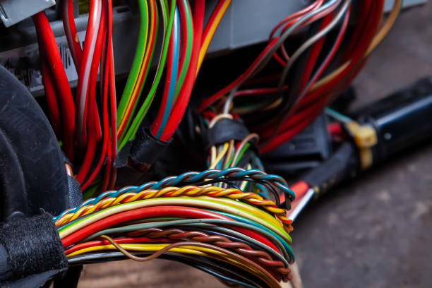 istock A bunch of multi-colored wires connecting various electronic systems for transmitting energy and information. Outdated communication systems. 1248252558