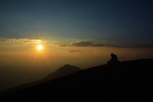 istock sunset in field the mountain 1248252872