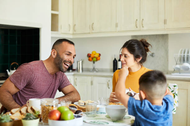 istock Happy man sitting by woman looking at boy 1248253763