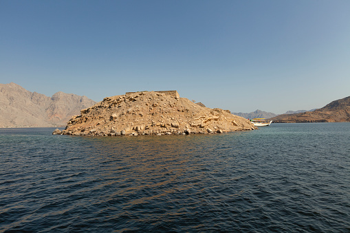 former military island, now a nice snorkel spot, telegraph island in musandam peninsula, sultanate of oman.
