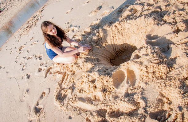 istock Little girl played on the beach sand 1248259377